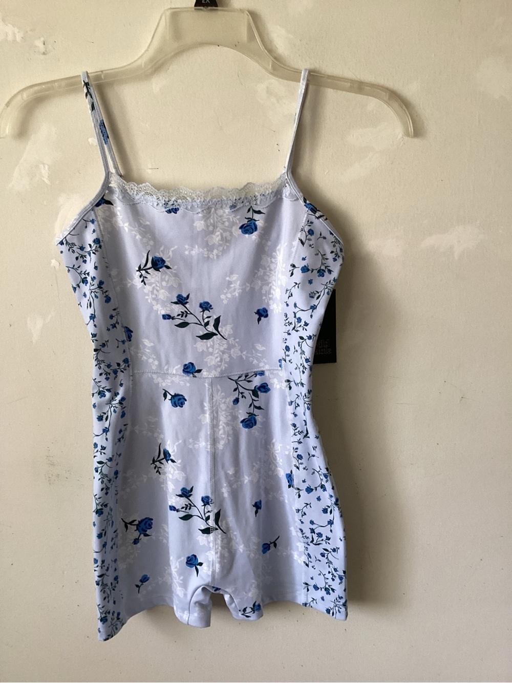 Wild Fable sleeveless romper with lace trim in the front.